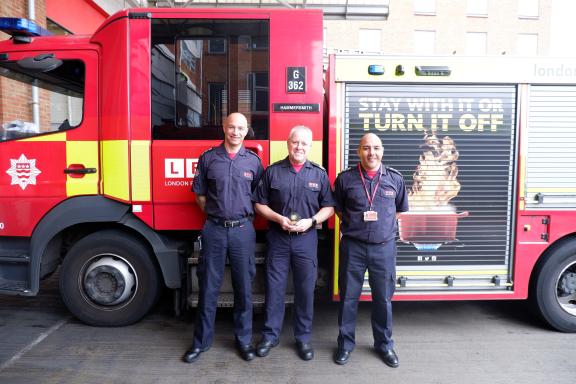 Image of London Fire Brigade colleagues stood in front of fire engine.